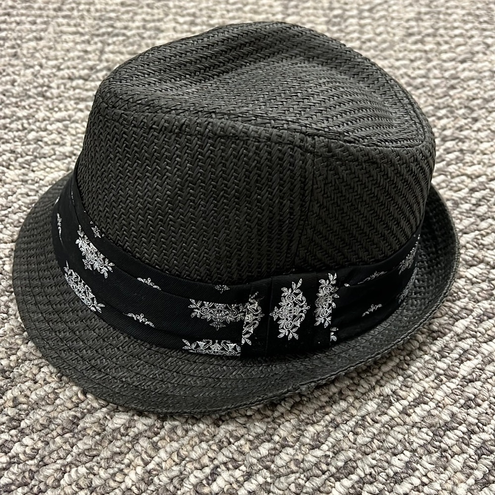 Bebe black fedora hat with decorative trim.